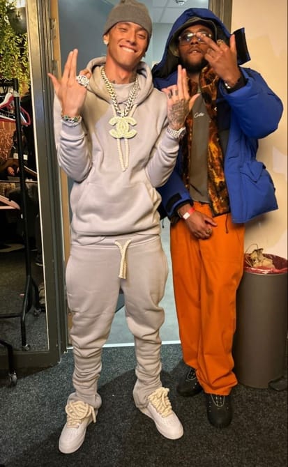 A person in a grey hoodie and orange pants
AI-generated content may be incorrect.